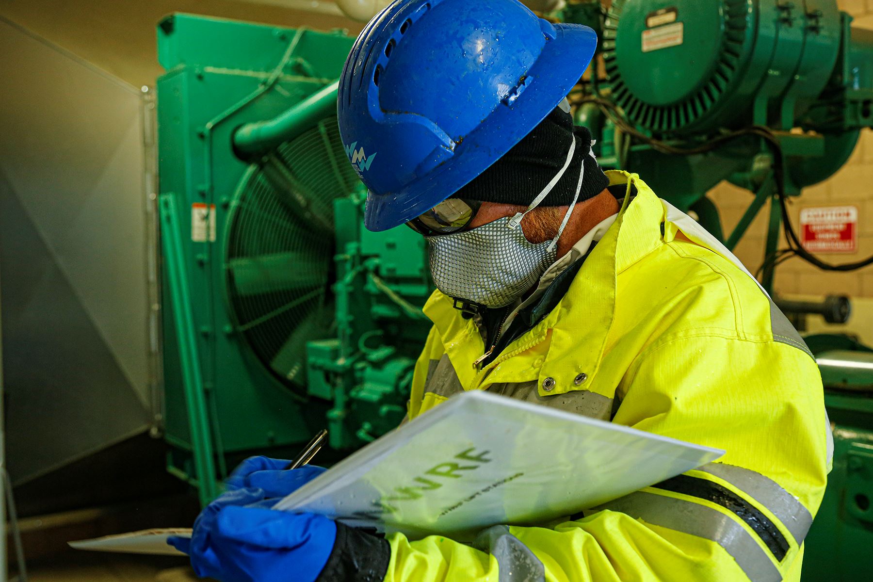 Western Staff with face covering working at Markham Lift Station 2020